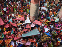 Indian devotees collect holy rice during the Annakut Utsav (Govardhan Puja) at Madan Mohon Mandir in Kolkata, India, on November 2, 2024. Pe...