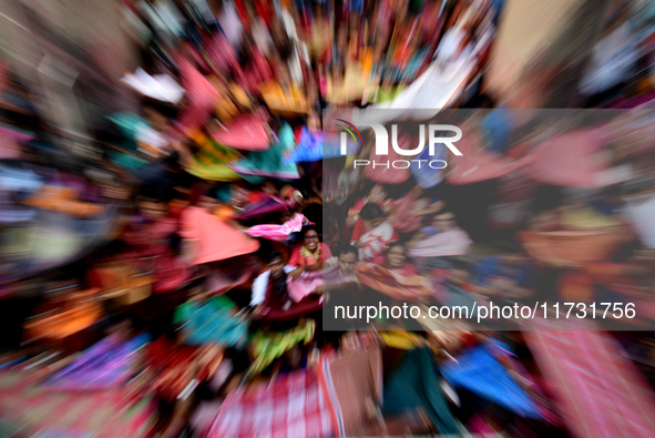 Hindu devotees participate in the 'Annakut' or 'Govardhan Puja' festival at the Madan Mohan temple in Kolkata, India, on November 2, 2024. G...