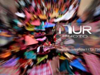 Hindu devotees participate in the 'Annakut' or 'Govardhan Puja' festival at the Madan Mohan temple in Kolkata, India, on November 2, 2024. G...