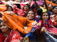 Indian devotees collect holy rice during the Annakut Utsav (Govardhan Puja) at Madan Mohon Mandir in Kolkata, India, on November 2, 2024. Pe...