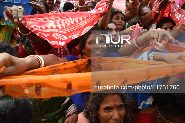 Hindu devotees participate in the 'Annakut' or 'Govardhan Puja' festival at the Madan Mohan temple in Kolkata, India, on November 2, 2024. G...