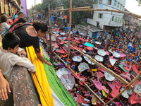 Shashi Panja, Minister of Women and Child Development and Social Welfare of West Bengal, and Indian devotees collect holy rice during the An...