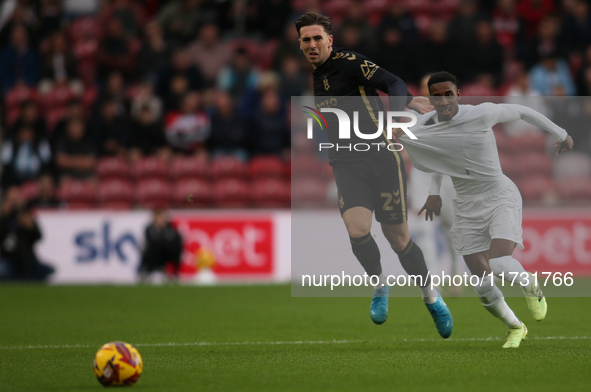 Isaiah Jones of Middlesbrough has his shirt pulled by Luis Binks of Coventry City during the Sky Bet Championship match between Middlesbroug...