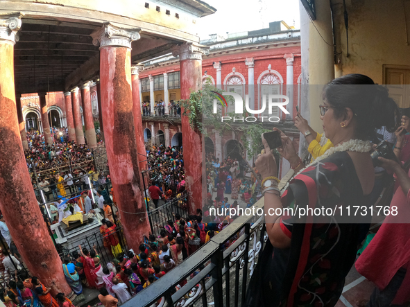 Shashi Panja, Minister of Women and Child Development and Social Welfare of West Bengal, captures the moment with her mobile camera during t...