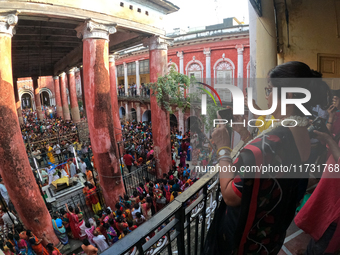 Shashi Panja, Minister of Women and Child Development and Social Welfare of West Bengal, captures the moment with her mobile camera during t...