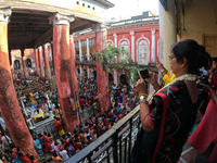 Shashi Panja, Minister of Women and Child Development and Social Welfare of West Bengal, captures the moment with her mobile camera during t...