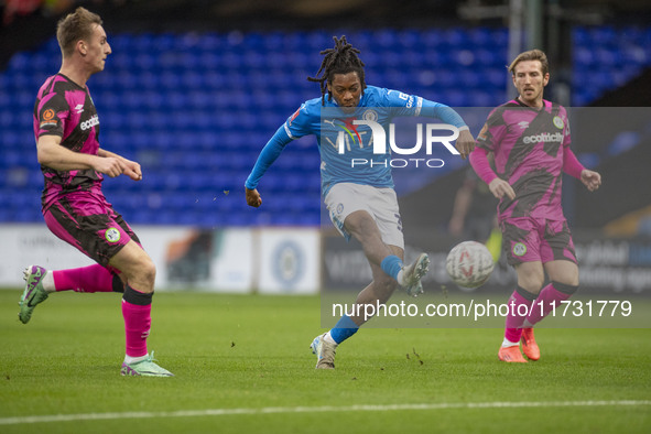 Tayo Adaramola #33 of Stockport County F.C. takes a shot at goal during the FA Cup First Round match between Stockport County and Forest Gre...