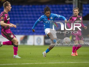 Tayo Adaramola #33 of Stockport County F.C. takes a shot at goal during the FA Cup First Round match between Stockport County and Forest Gre...