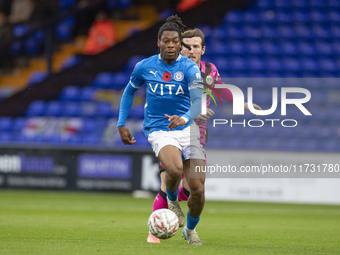 Tayo Adaramola, number 33 of Stockport County F.C., is in action during the FA Cup First Round match between Stockport County and Forest Gre...