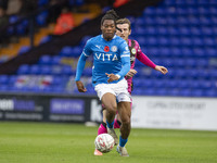 Tayo Adaramola, number 33 of Stockport County F.C., is in action during the FA Cup First Round match between Stockport County and Forest Gre...