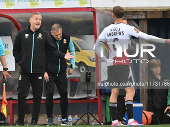 Manager Garry Monk of Cambridge United talks to Jamie Andrews of Woking during the FA Cup First Round match between Woking and Cambridge Uni...