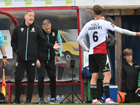 Manager Garry Monk of Cambridge United talks to Jamie Andrews of Woking during the FA Cup First Round match between Woking and Cambridge Uni...