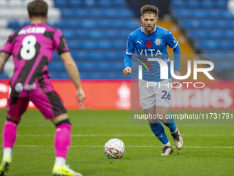 Oliver Norwood #26 of Stockport County F.C. is in action during the FA Cup First Round match between Stockport County and Forest Green Rover...