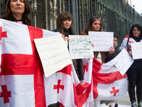 A dozen protesters gather in front of Dom Cathedral to contest the result of the Georgian election and demand a new election in Cologne, Ger...