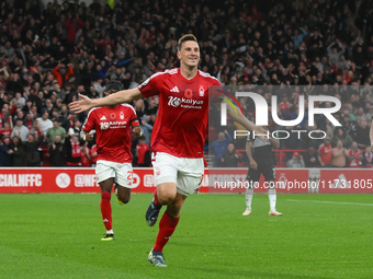 Chris Wood of Nottingham Forest celebrates after scoring a goal to make it 1-0 during the Premier League match between Nottingham Forest and...