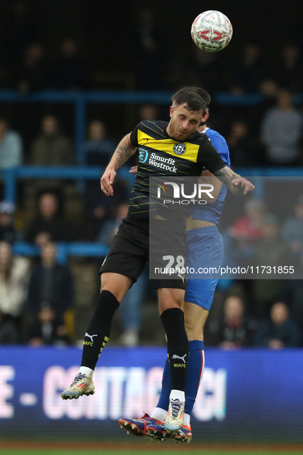 Dale Taylor of Wigan Athletic heads the ball during the FA Cup First Round match between Carlisle United and Wigan Athletic at Brunton Park...