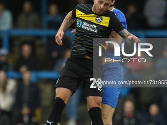 Dale Taylor of Wigan Athletic heads the ball during the FA Cup First Round match between Carlisle United and Wigan Athletic at Brunton Park...