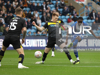 Daniel Adu-Adjei of Carlisle United takes a shot at goal during the FA Cup First Round match between Carlisle United and Wigan Athletic at B...