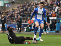 Steven Sessegnon of Wigan Athletic challenges Jon Mellish of Carlisle United during the FA Cup First Round match between Carlisle United and...