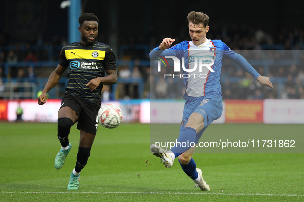 Taylor Charters of Carlisle United crosses the ball during the FA Cup First Round match between Carlisle United and Wigan Athletic at Brunto...