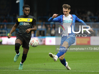 Taylor Charters of Carlisle United crosses the ball during the FA Cup First Round match between Carlisle United and Wigan Athletic at Brunto...