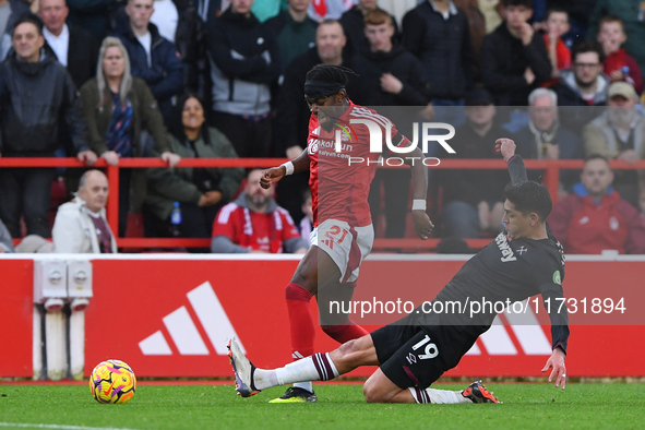 Edson Alvarez of West Ham United fouls Anthony Elanga of Nottingham Forest, earning a second yellow/red card during the Premier League match...