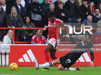 Edson Alvarez of West Ham United fouls Anthony Elanga of Nottingham Forest, earning a second yellow/red card during the Premier League match...