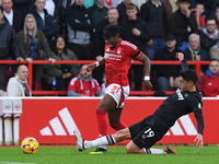 Edson Alvarez of West Ham United fouls Anthony Elanga of Nottingham Forest, earning a second yellow/red card during the Premier League match...