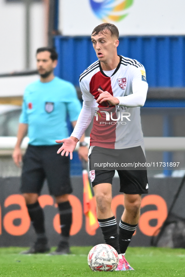 Jamie Andrews (6 Woking) goes forward during the FA Cup First Round match between Woking and Cambridge United at the Kingfield Stadium in Wo...