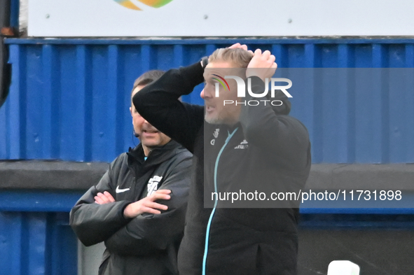 Manager Garry Monk, the manager of Cambridge United, holds his head after a goal decision goes against his side during the FA Cup First Roun...