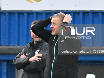 Manager Garry Monk, the manager of Cambridge United, holds his head after a goal decision goes against his side during the FA Cup First Roun...