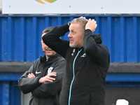 Manager Garry Monk, the manager of Cambridge United, holds his head after a goal decision goes against his side during the FA Cup First Roun...