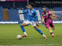 Odin Bailey, number 27 of Stockport County F.C., stretches for the ball during the FA Cup First Round match between Stockport County and For...