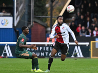 Raheem Conte, 18, from Woking, controls the ball during the FA Cup First Round match between Woking and Cambridge United at the Kingfield St...