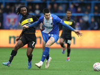 Dion Rankine of Wigan Athletic and Jon Mellish of Carlisle United battle for the ball during the FA Cup First Round match between Carlisle U...