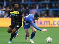 Dion Rankine of Wigan Athletic and Jon Mellish of Carlisle United battle for the ball during the FA Cup First Round match between Carlisle U...