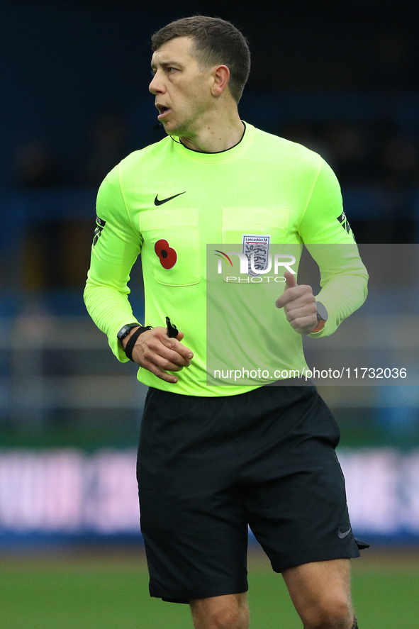 Referee Martin Woods officiates the FA Cup First Round match between Carlisle United and Wigan Athletic at Brunton Park in Carlisle, United...