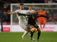 Tommy Conway of Middlesbrough challenges Joel Latibeaudiere of Coventry City during the Sky Bet Championship match between Middlesbrough and...