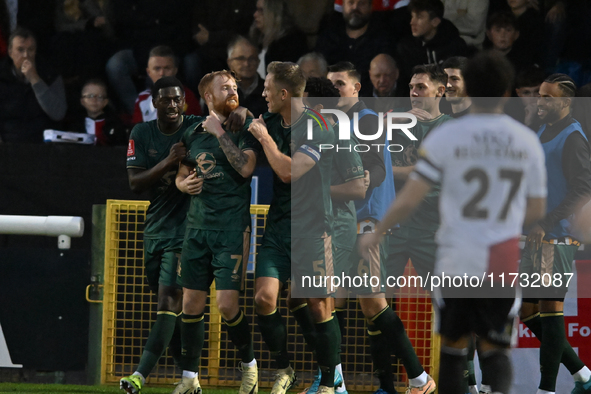 James Brophy (7, Cambridge United) celebrates after scoring the team's first goal during the FA Cup First Round match between Woking and Cam...