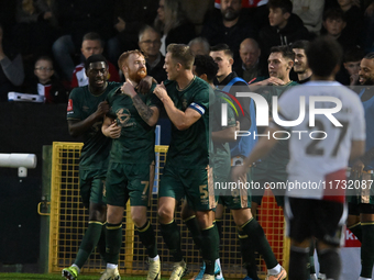 James Brophy (7, Cambridge United) celebrates after scoring the team's first goal during the FA Cup First Round match between Woking and Cam...