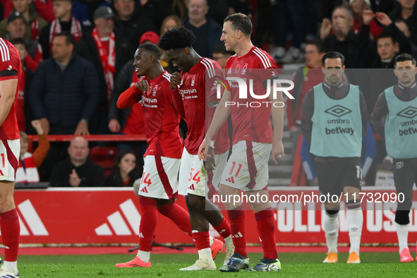 Goal scorers Callum Hudson-Odoi, Ola Aina, and Chris Wood of Nottingham Forest participate in the Premier League match between Nottingham Fo...