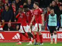 Goal scorers Callum Hudson-Odoi, Ola Aina, and Chris Wood of Nottingham Forest participate in the Premier League match between Nottingham Fo...