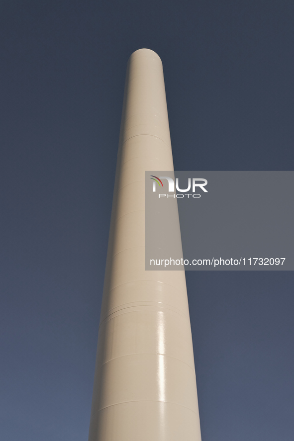 A large crane assembles a wind turbine in the rolling hills of Castelluccio dei Sauri, Foggia, Italy, on November 1, 2024. This wind farm ex...