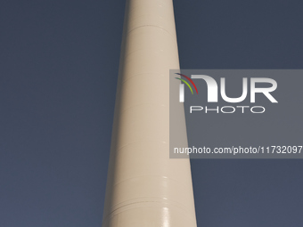 A large crane assembles a wind turbine in the rolling hills of Castelluccio dei Sauri, Foggia, Italy, on November 1, 2024. This wind farm ex...