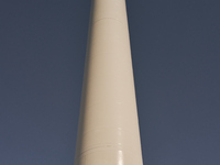 A large crane assembles a wind turbine in the rolling hills of Castelluccio dei Sauri, Foggia, Italy, on November 1, 2024. This wind farm ex...