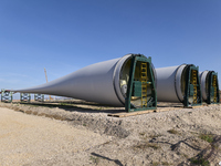 A large crane assembles a wind turbine in the rolling hills of Castelluccio dei Sauri, Foggia, Italy, on November 1, 2024. This wind farm ex...