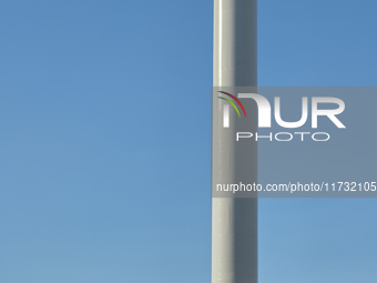 A large crane assembles a wind turbine in the rolling hills of Castelluccio dei Sauri, Foggia, Italy, on November 1, 2024. This wind farm ex...