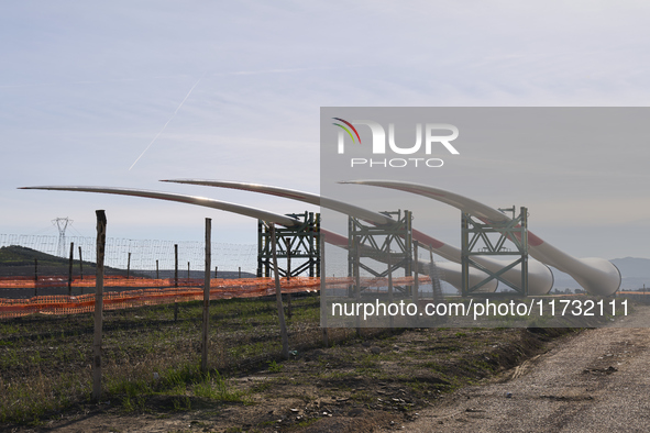 A large crane assembles a wind turbine in the rolling hills of Castelluccio dei Sauri, Foggia, Italy, on November 1, 2024. This wind farm ex...