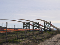 A large crane assembles a wind turbine in the rolling hills of Castelluccio dei Sauri, Foggia, Italy, on November 1, 2024. This wind farm ex...