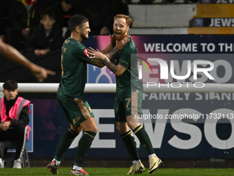 James Brophy (7, Cambridge United) celebrates after scoring the team's first goal during the FA Cup First Round match between Woking and Cam...